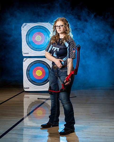 girl archer poses for sports picture day zimmerman, mn